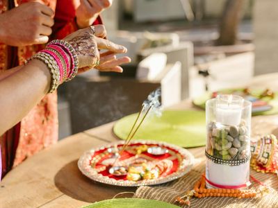 Incense sticks and a candle on a table
